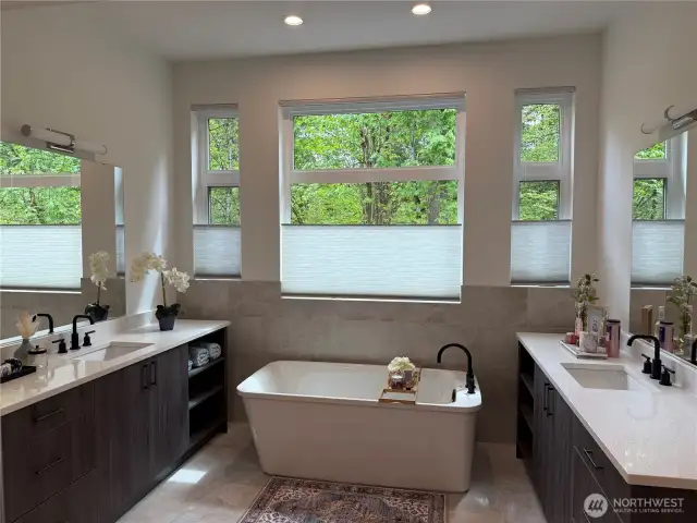 Spoil Yourself in this Primary Ensuite that has a Beautiful Soaking Tub and Dual Vanities. You will also Love the Elegant Tile on the Floors.