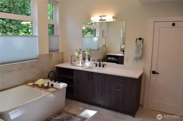 Another Viewing the 2nd Vanity and Soaking Tub in the Luxurious Primary Ensuite.