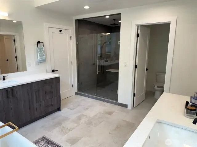 Ensuite Vanity and a view of the 37 Sq. ft. Spa Shower.