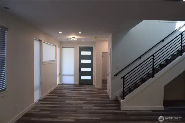 Inviting Grand Foyer to Welcome You and your guests. There is Gorgeous Vinyl Plank Flooring Throughout all the Living Spaces and Bedrooms. Another Upgrade Window Treatments on all of the Windows.