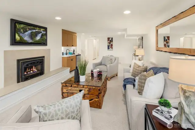 Retreat to the walk out lower level. Such a cozy space. This heatilator gas fireplace really kicks out the heat when you need it.