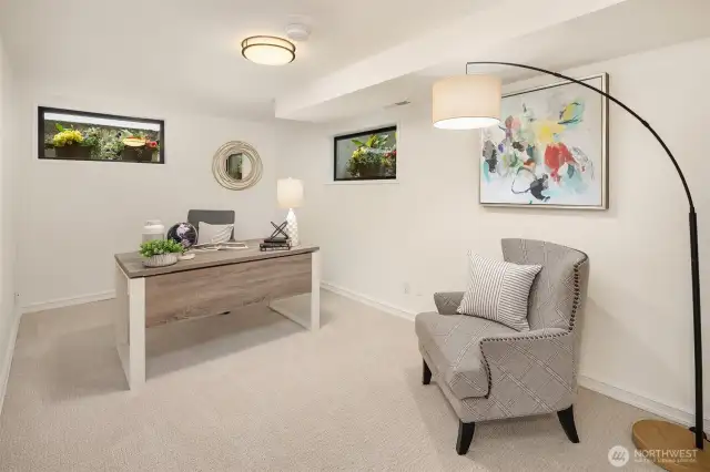 5th bedroom staged as an office has 3 nice windows lightening up the spaces beautifully.