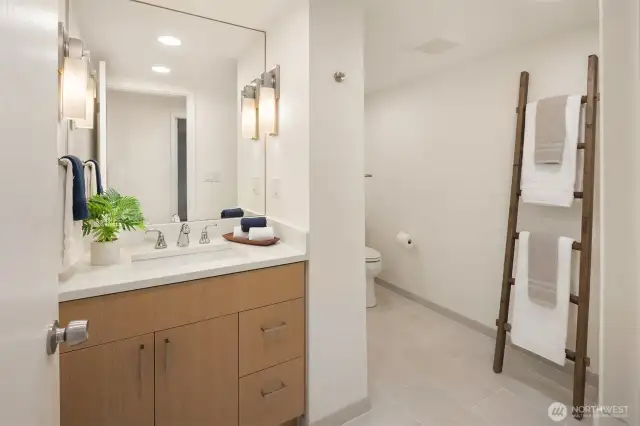 Fully remodeling bathroom boasts a big walk-in shower around the corner!