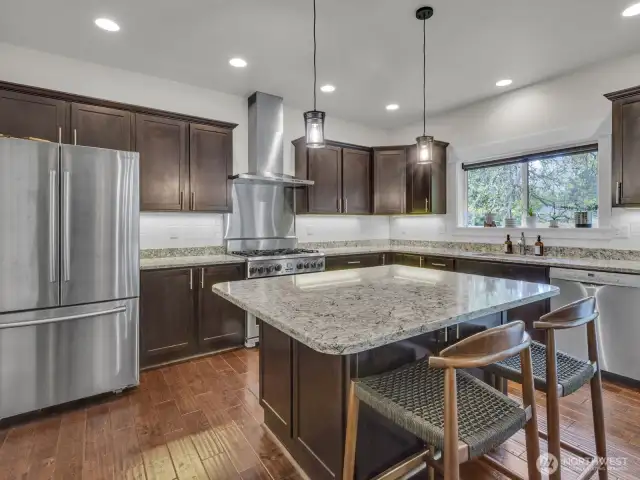 Stainless steel appliances and 6 burner gas stove.