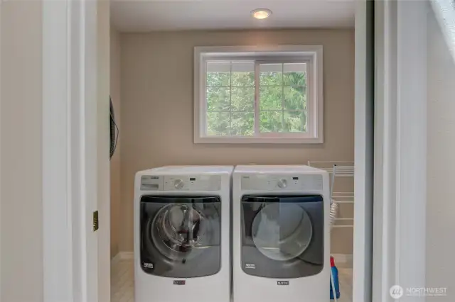 Upstairs full laundry room with plenty of working space