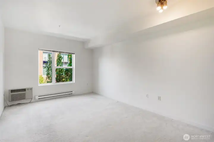 Bedroom with A/C wall unit