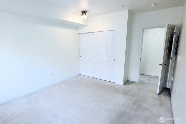 Bedroom looking at closet. Built-ins inside.