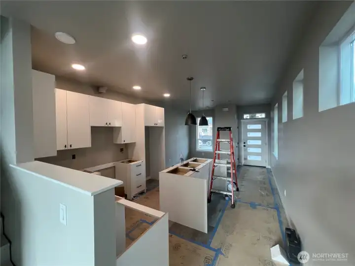 Kitchen looking back to front door and eating area