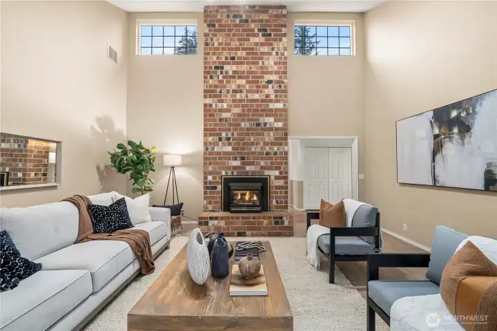 Full height brick fireplace makes a wow factor living room.