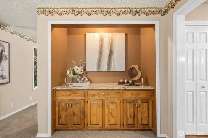 Lovely built in, recessed serving area provides extra storage.