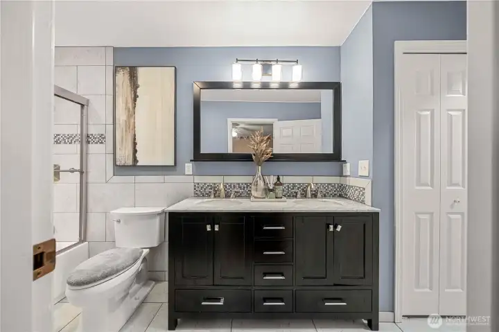 Fully updated upstairs bathroom. Connects to hallway and bedroom #2.