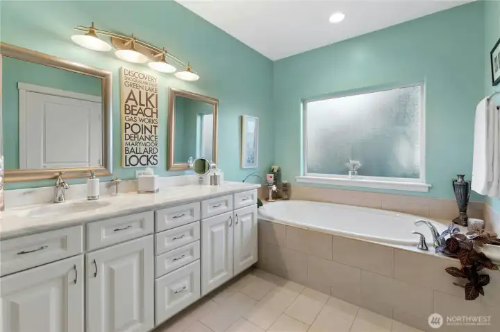 Primary bath with large tub and double shower.