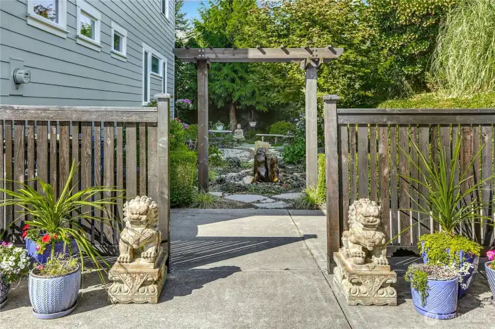 Foo Dogs greet you into the East garden (with another basalt water fountain).