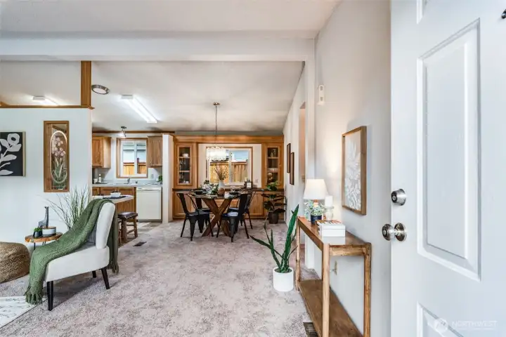 Enter to find a bright living space gleaming with new paint and flooring.