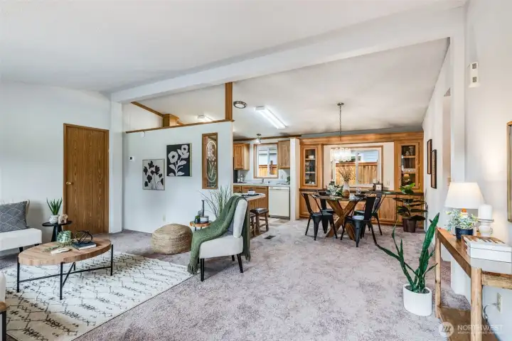 The living room flows seamlessly to the dining space and kitchen!