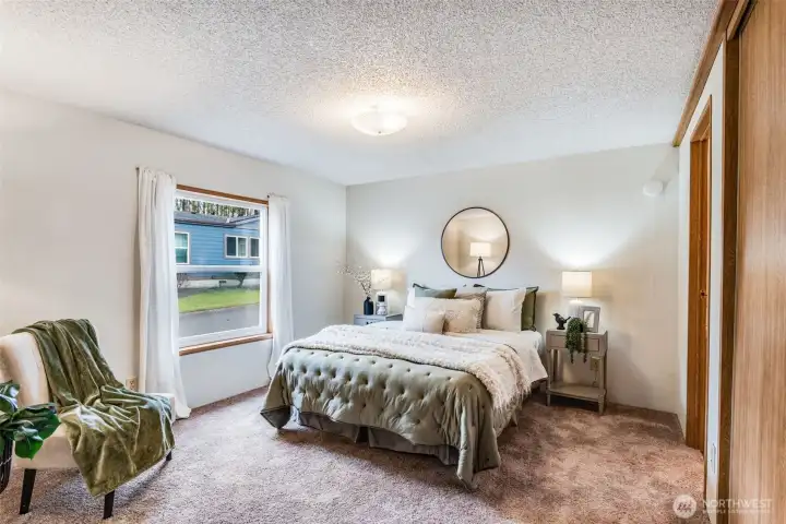 The large primary suite has great natural light.