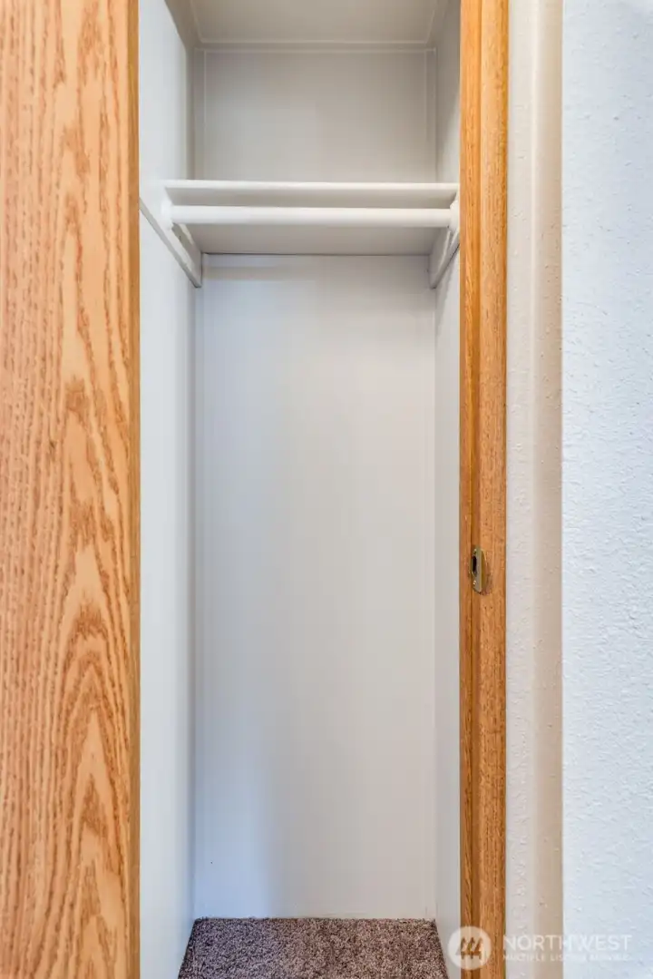 This handy coat closet is tucked in the hallway next to the front entry.