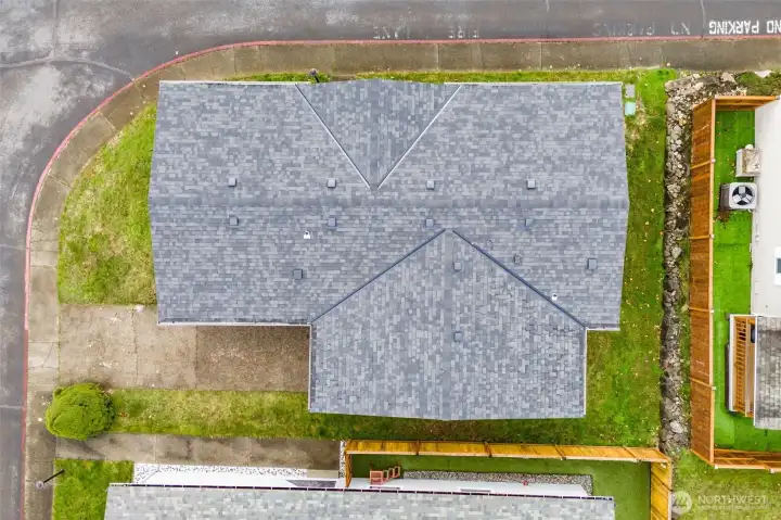 Aerial view showing the lot and brand new roof!