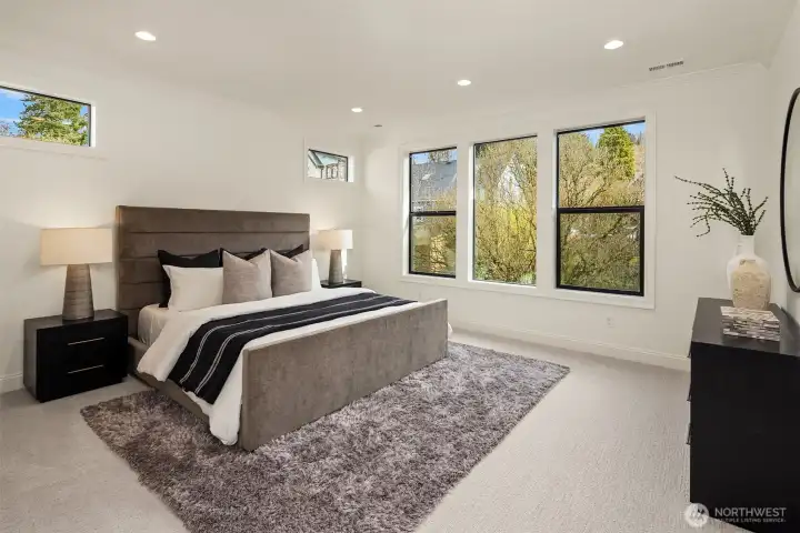 Designer primary suite with five-piece bath with heated floors