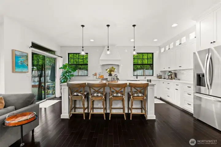 Large open concept kitchen with inset cabinets