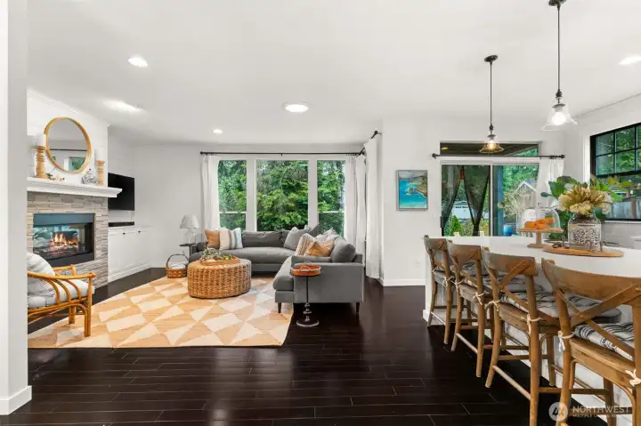 flows to living room with double sided fireplace