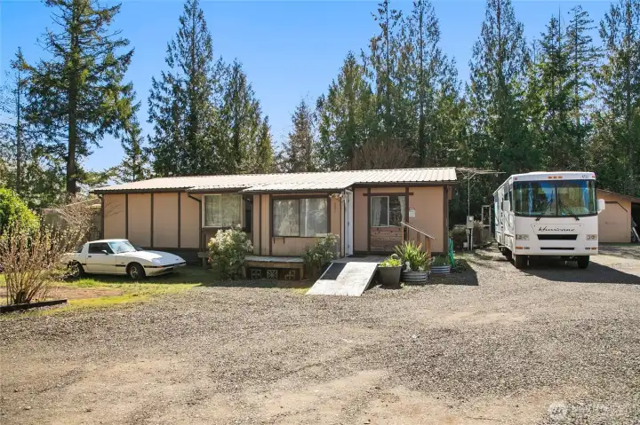 Front of home without staged bushes.