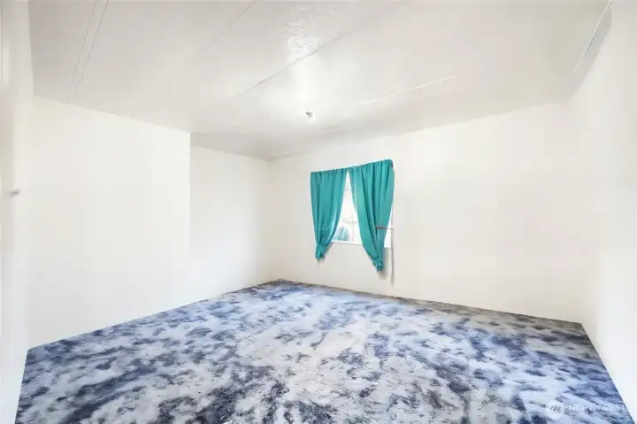 Third bedroom shown virtually staged as empty for photos; currently filled with belongings.