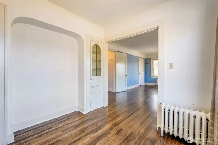Unit 301 dining area with built in leaded glass cabinet