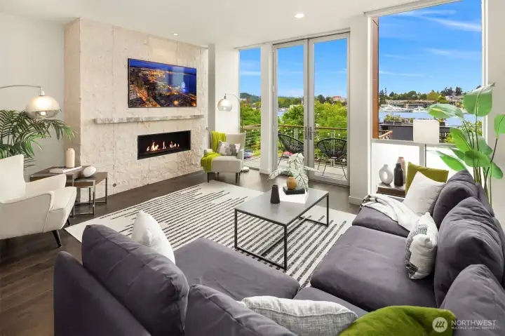 Large living room with fireplace and views of Lake union