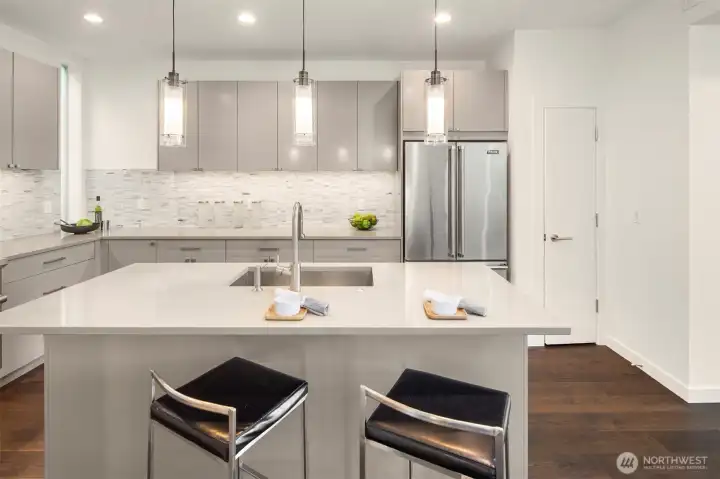 Kitchen counter easily seats two, for casual dining.