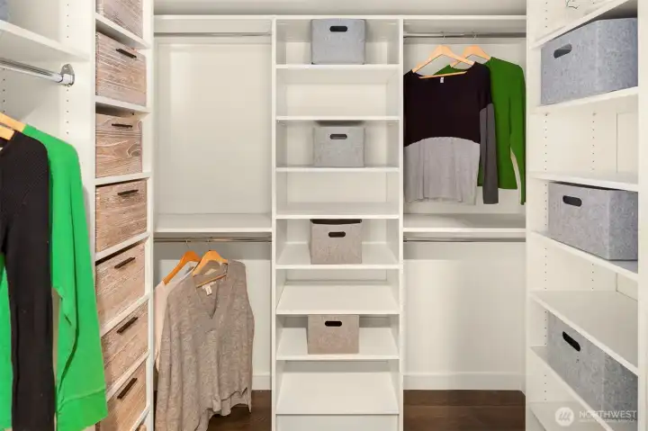 Primary walk in closet with built ins