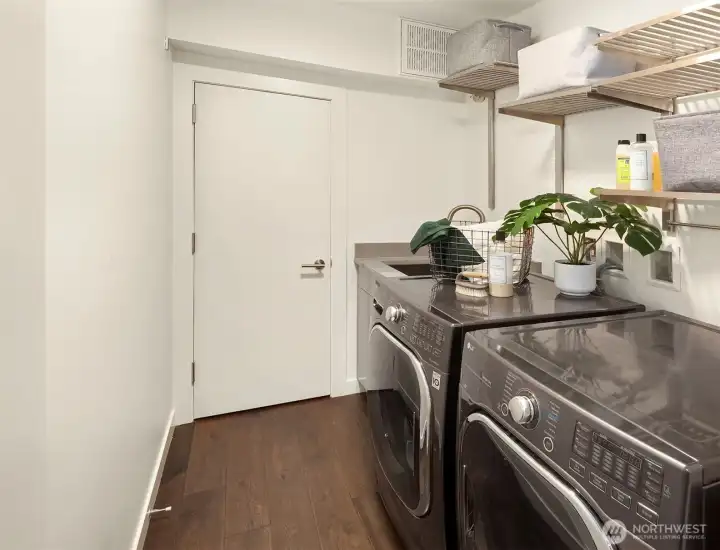 Large laundry room with storage