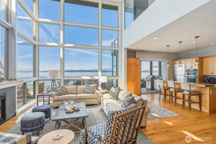 The open kitchen features custom cabinetry and flows seamlessly from the living area.