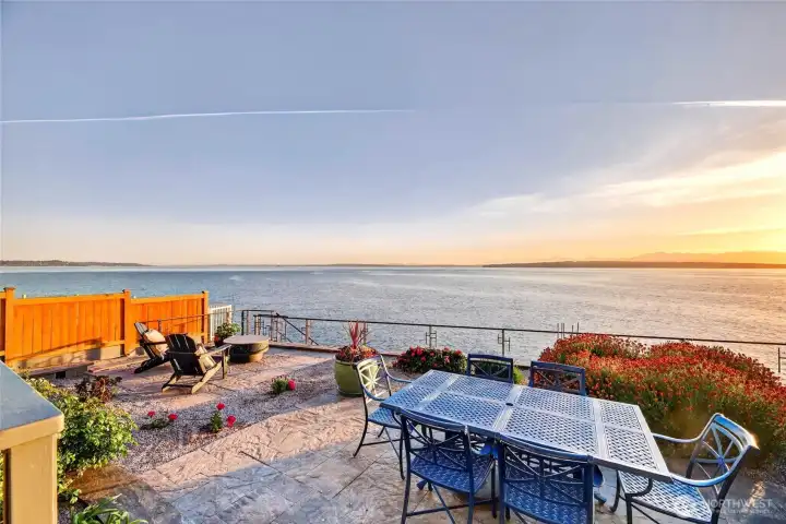 A low-maintenance yard leads to gated stairs down to the beach.