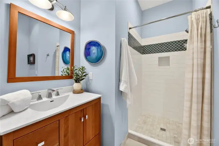 The main-level ensuite bath is well-appointed and generously sized.