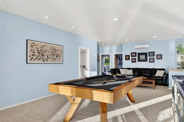 Looking toward the laundry room and two additional east-facing bedrooms.