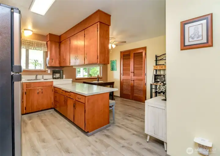 Light and bright kitchen and dining room over look the patio and backyard.