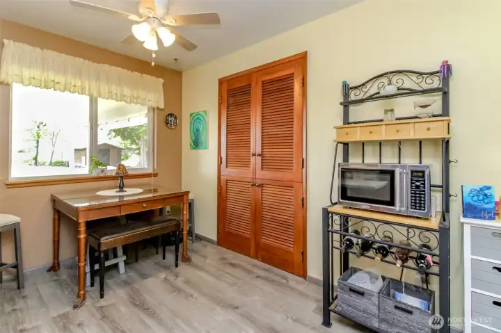 Additional built in deep storage for dishes and kitchen appliances in the dining room.