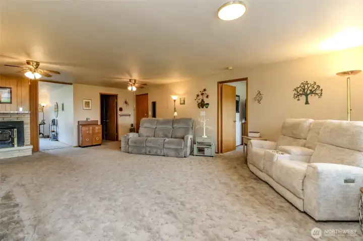 Another view of the huge family room - notice the wood burning insert! This is one of two fireplaces to heat the home!