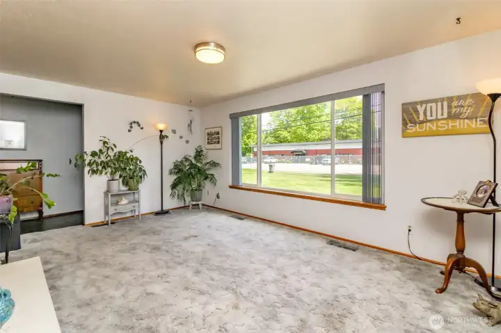 The living room graces the front of the home and overlooks the big level front yard. Huge picture window for natural light!