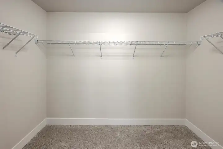 Spacious primary closet Spacious primary closet