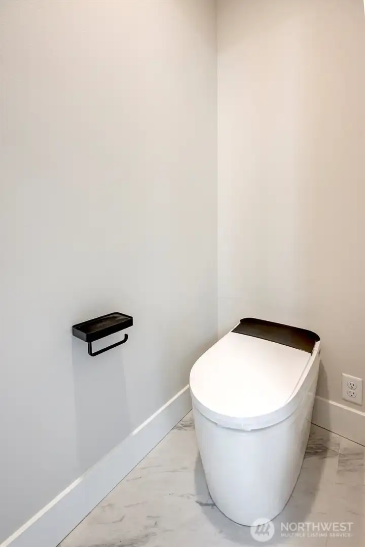 Smart toilet in primary bath with bidet and heated seat Smart toilet in primary bath with bidet and heated seat