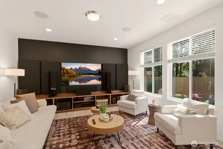 Spacious and sunny great room with theater surround speakers and acoustic treatment with walls of windows Spacious and sunny great room with theater surround speakers and acoustic treatment with walls of windows