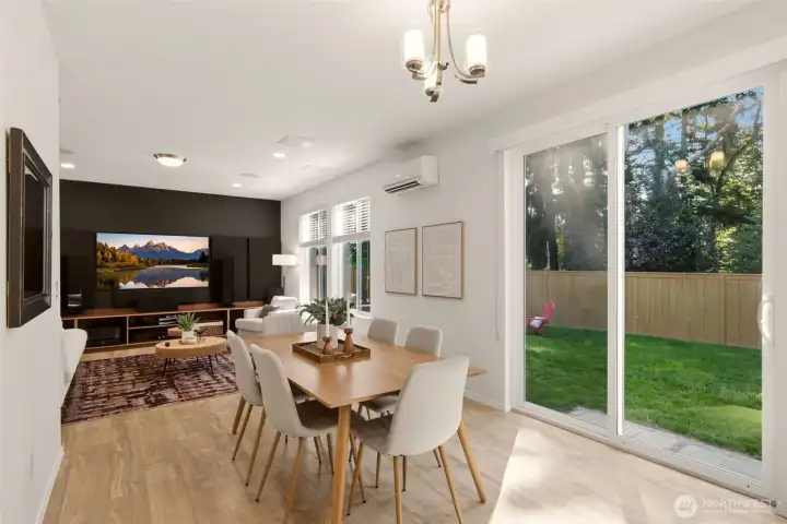 Slider to large grassy backyard from dining room Slider to large grassy backyard from dining room
