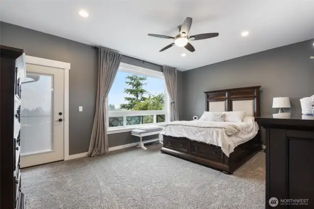 Primary Bedroom with door that opens up the main level deck.