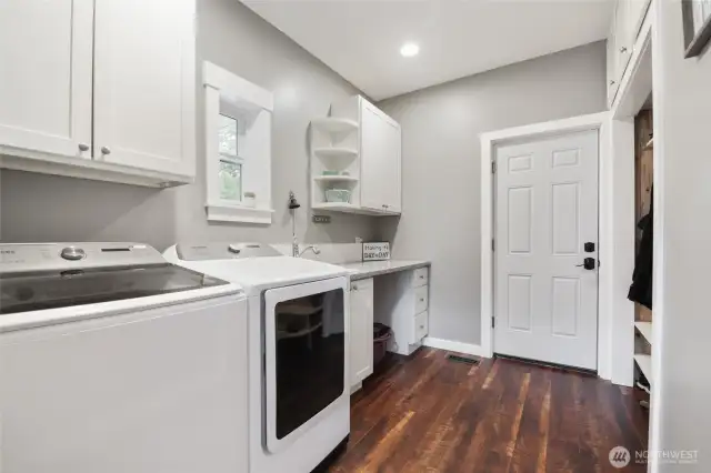 Lots of room in this utility space that opens up to the garage from main level hallway.