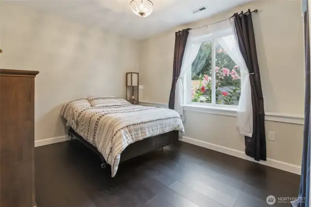 One of the two bedrooms downstairs, plenty of natural light.