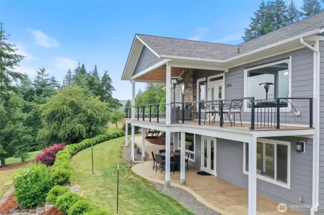 Back of the home showing the upper deck and the porch on the lower level.