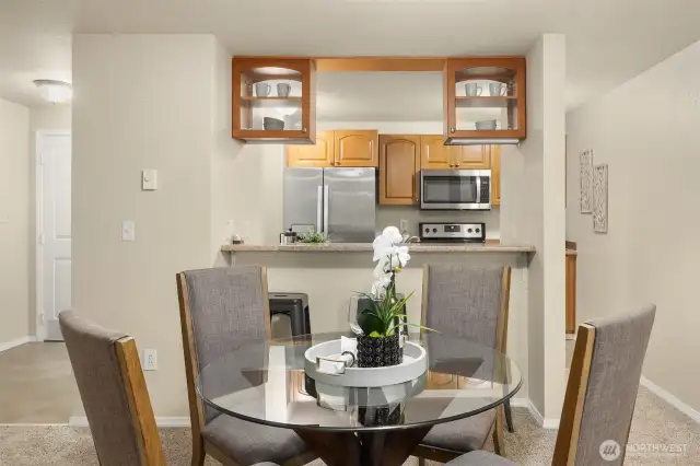 Dining area flowing seamlessly into kitchen.