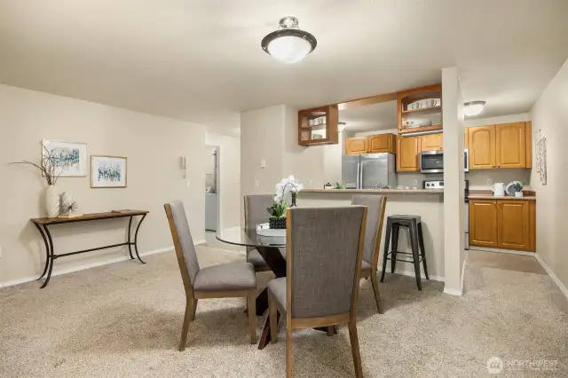 Open-concept dining and kitchen space.